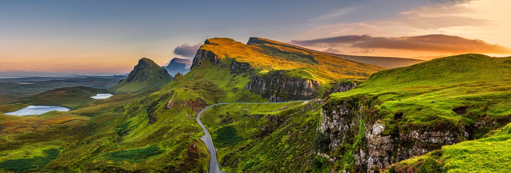 Isle of Skye mountain landscape at sunset with winding road, Scottish Highlands