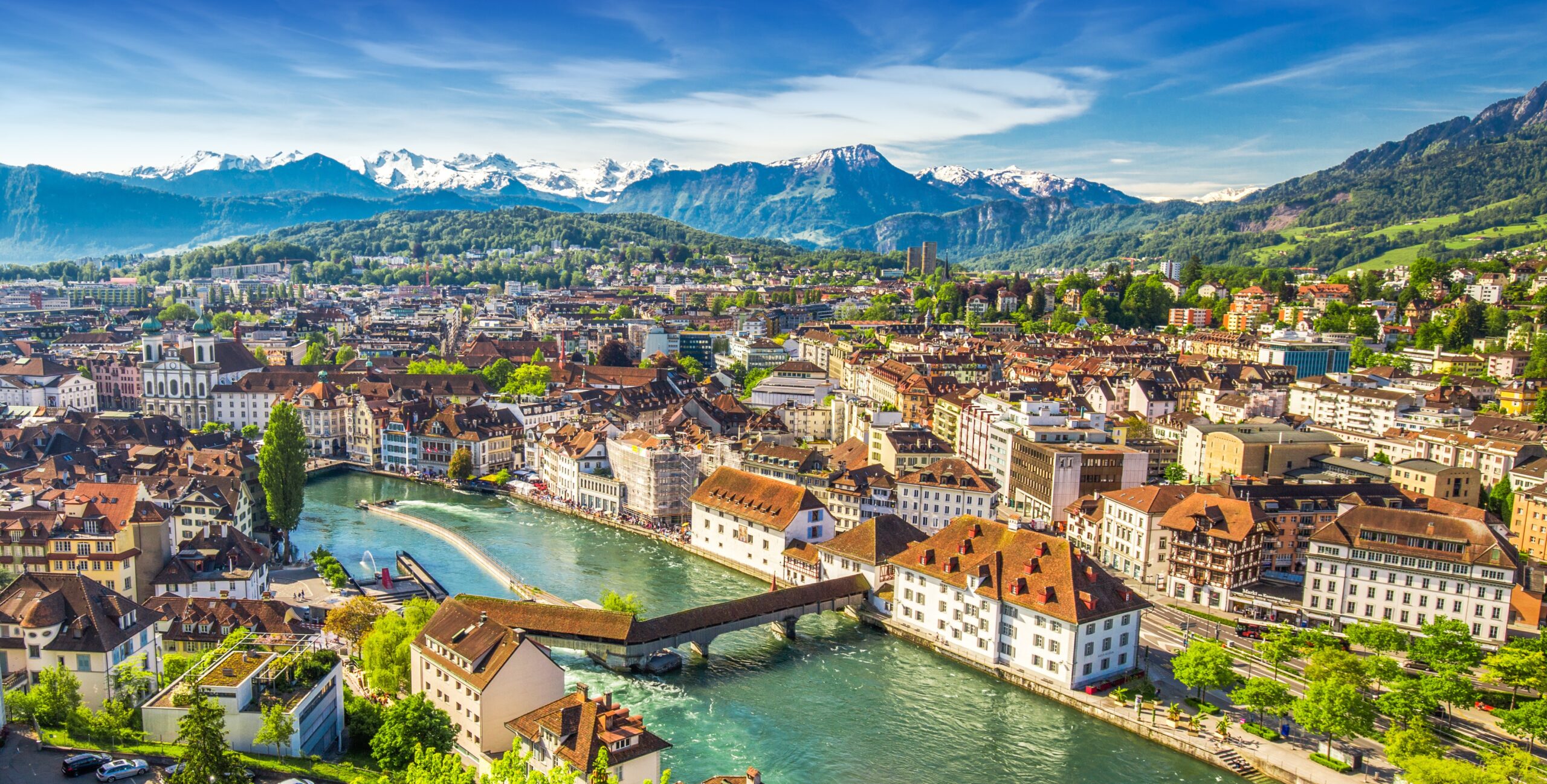 Lucerne Switzerland city skyline with river and mountains on European Explorer multi country tour