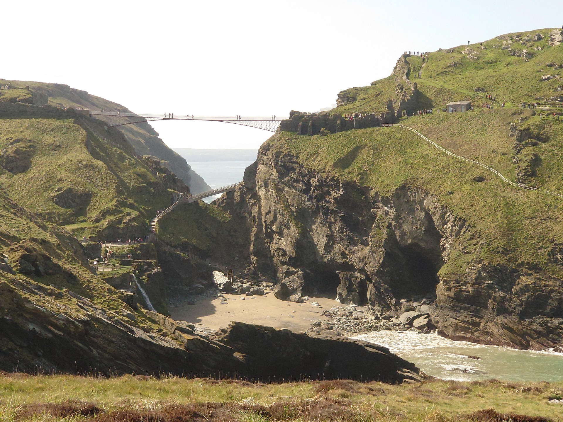 Tintagel Castle footbridge and cliffs overlooking Merlin’s Cave on the Cornwall coast